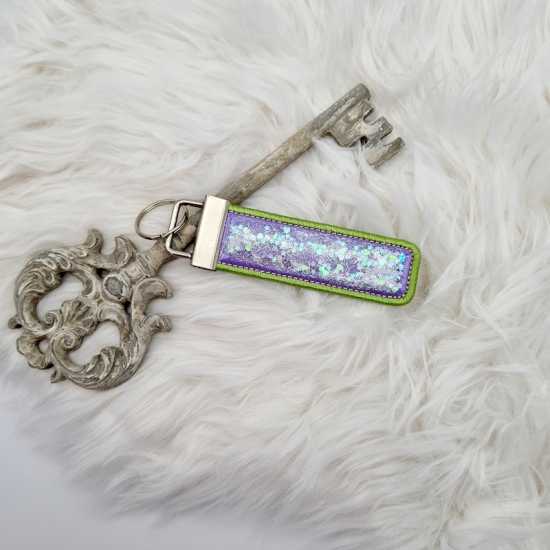 Preview: Schneekugeleffekt Schlüsselanhänger lila/grün