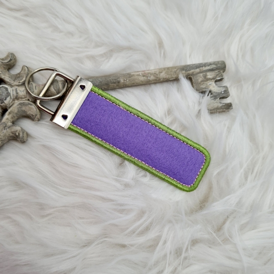 Preview: Schneekugeleffekt Schlüsselanhänger lila/grün