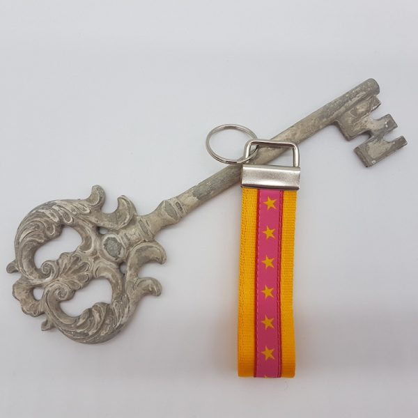 Schlüsselanhänger Gurtband gelb / Sterne pink